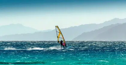 windsurfer rides on a background of high mountains in Egypt Dahab